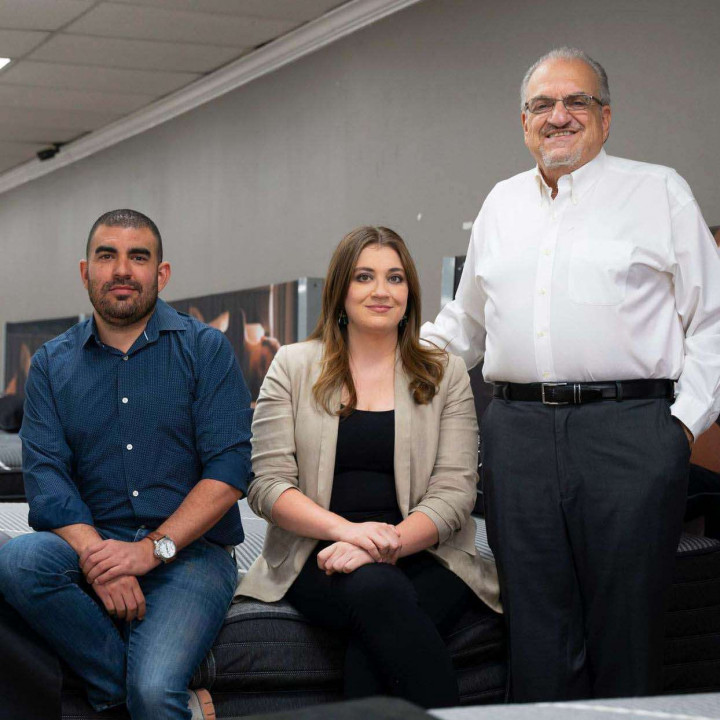 Three generations of the Popular Mattress family inside an El Paso showroom